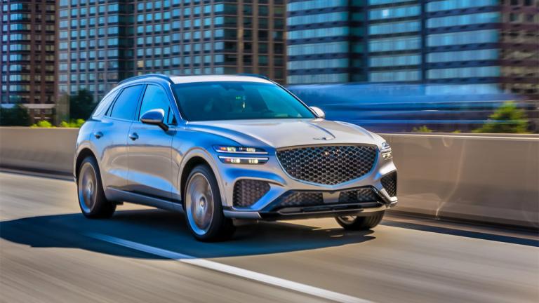 2025 Genesis GV70 driving on the road.